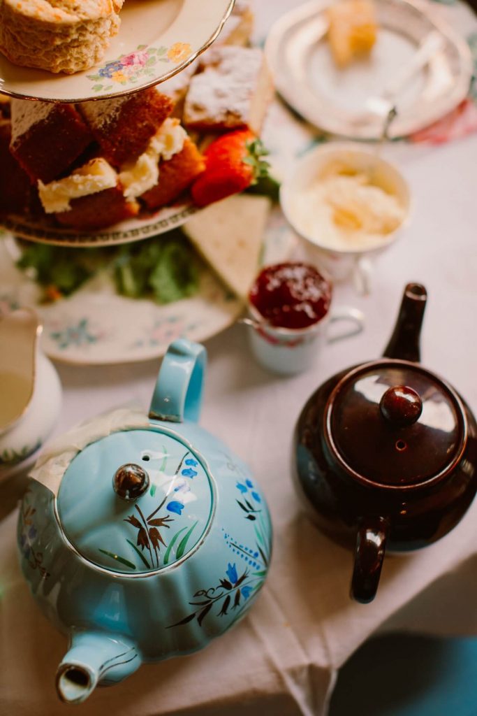 vintage tea pots and cake stands with cakes at Ashwell & Co