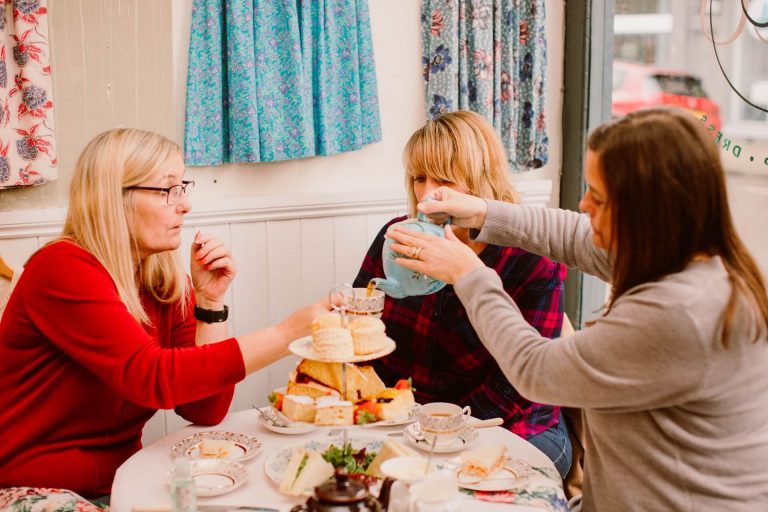 friends pouring tea during afternoon tea at Ashwell & Co tea room