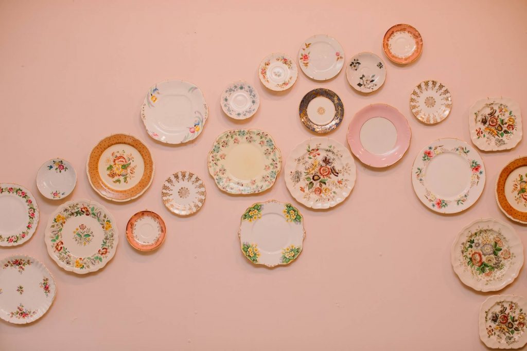 vintage plates displayed on the wall in Ashwell & Co tearoom