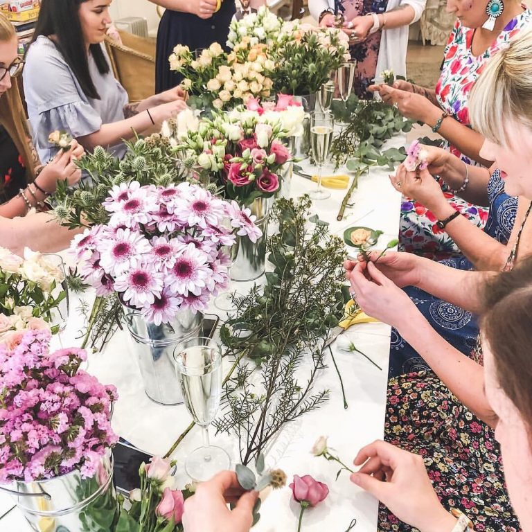 A group of ladies at a flower crown workshop at Ashwell & Co