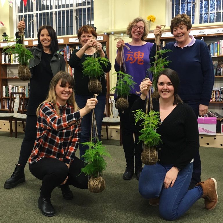 A group of ladies with their kokedama plant hangers